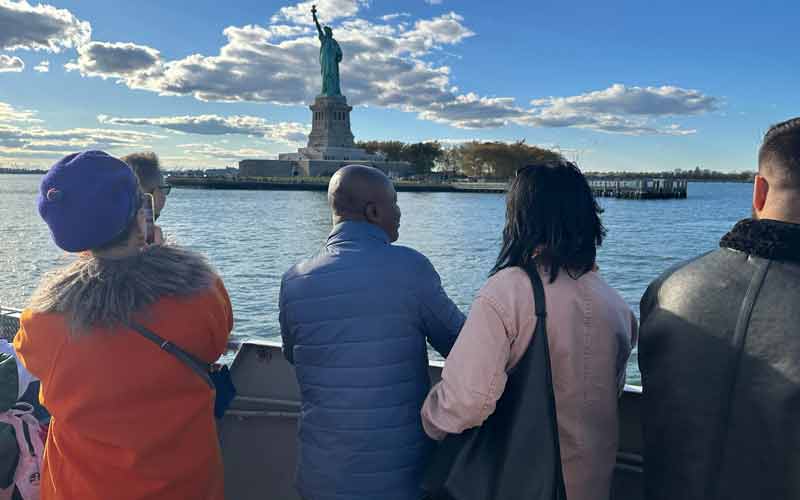 Guests aboard a New York harbor sightseeing cruise.